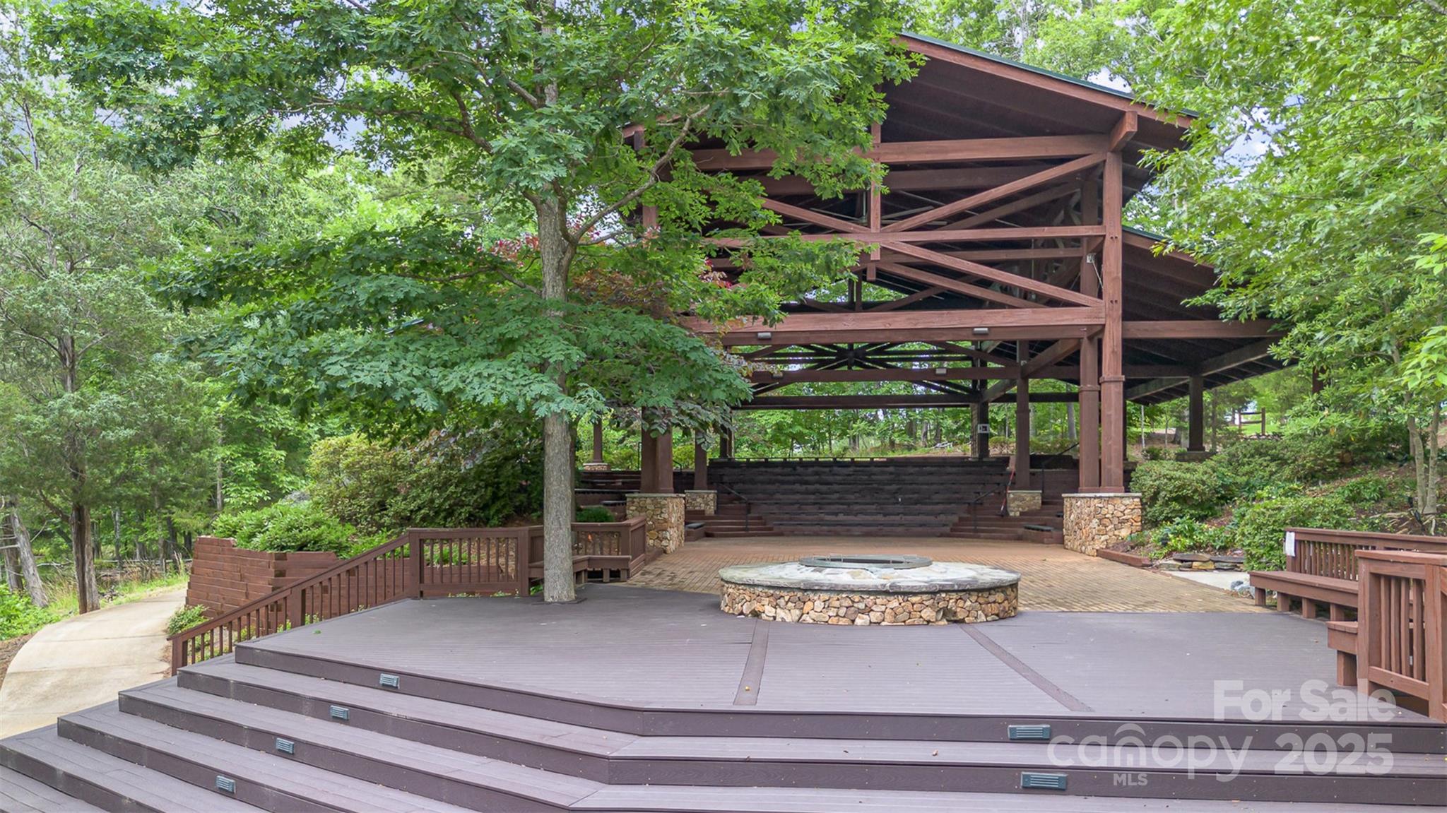 1663 Tranquility Boulevard Lancaster, SC 29720 - Photo 40 of 42 a view of a patio with table and chairs with wooden floor and fence