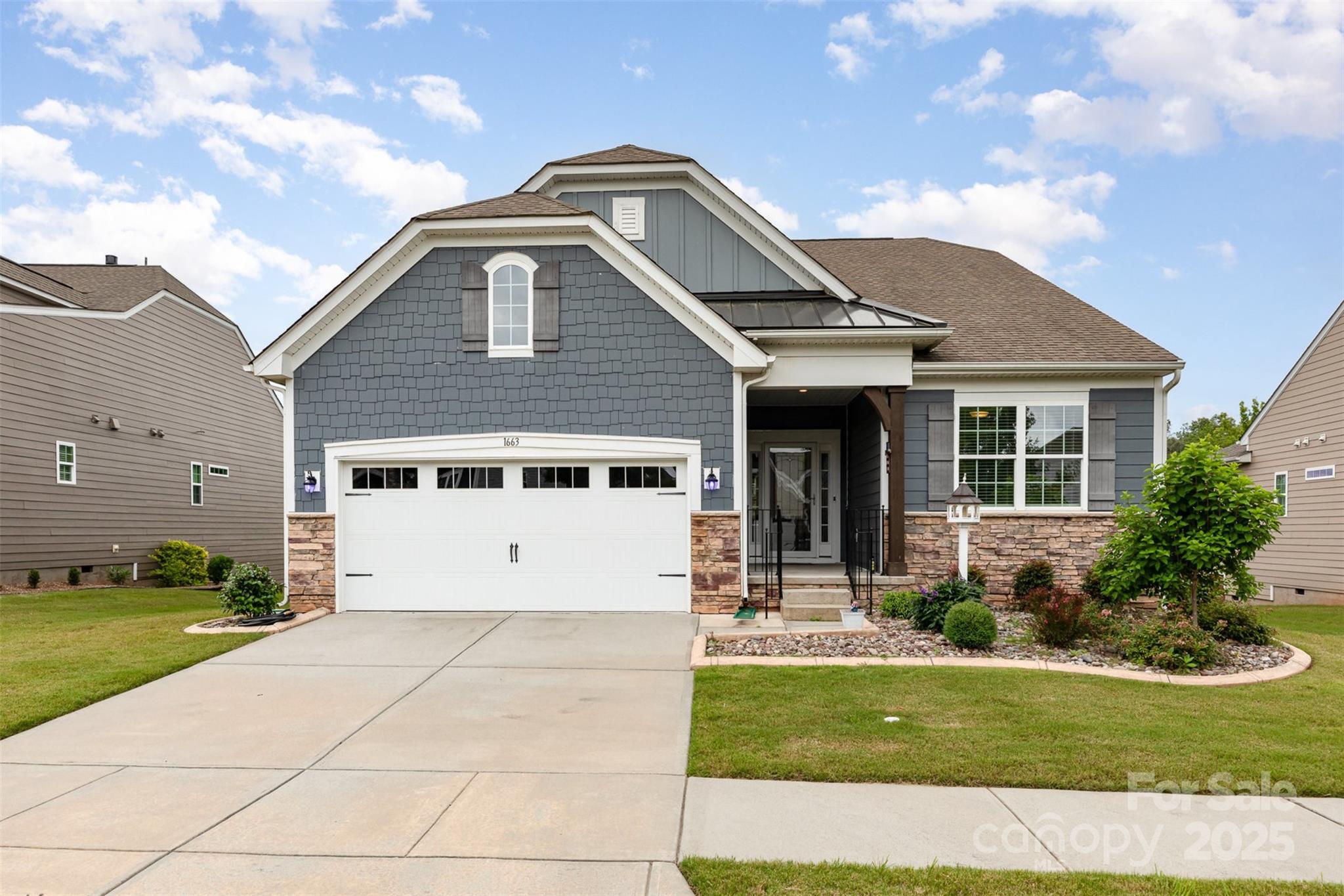 1663 Tranquility Boulevard Lancaster, SC 29720 - Photo 5 of 42 a front view of a house with a yard