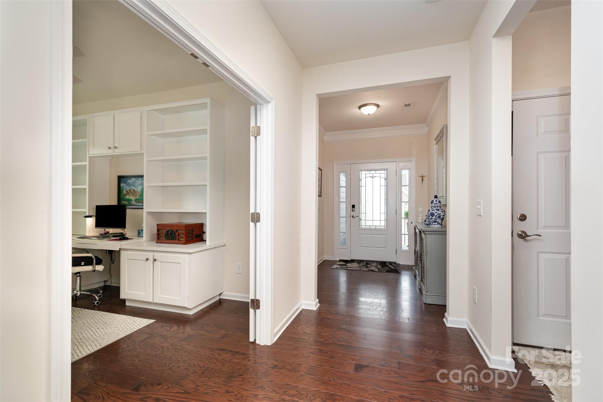 1663 Tranquility Boulevard Lancaster, SC 29720 - Photo 7 of 42 a view of a hallway with kitchen and wooden floor