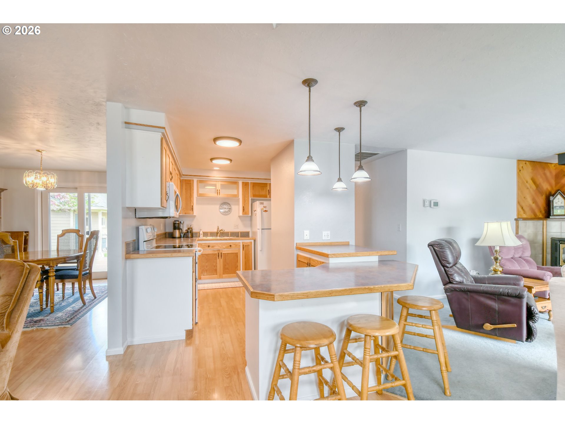 329 West Garfield Street Athena, OR 97813 - Photo 11 of 46 a living room with stainless steel appliances kitchen island granite countertop furniture and a view of kitchen