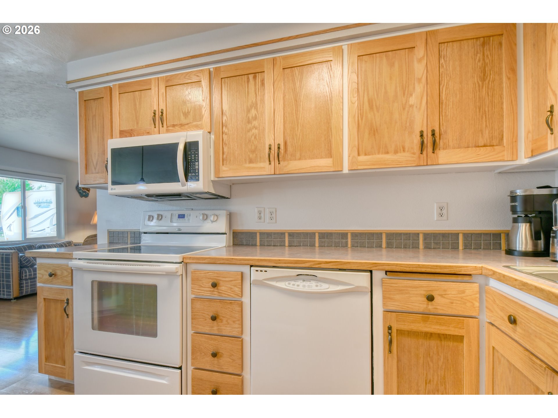 329 West Garfield Street Athena, OR 97813 - Photo 16 of 46 a kitchen with stainless steel appliances granite countertop a stove a sink and a microwave
