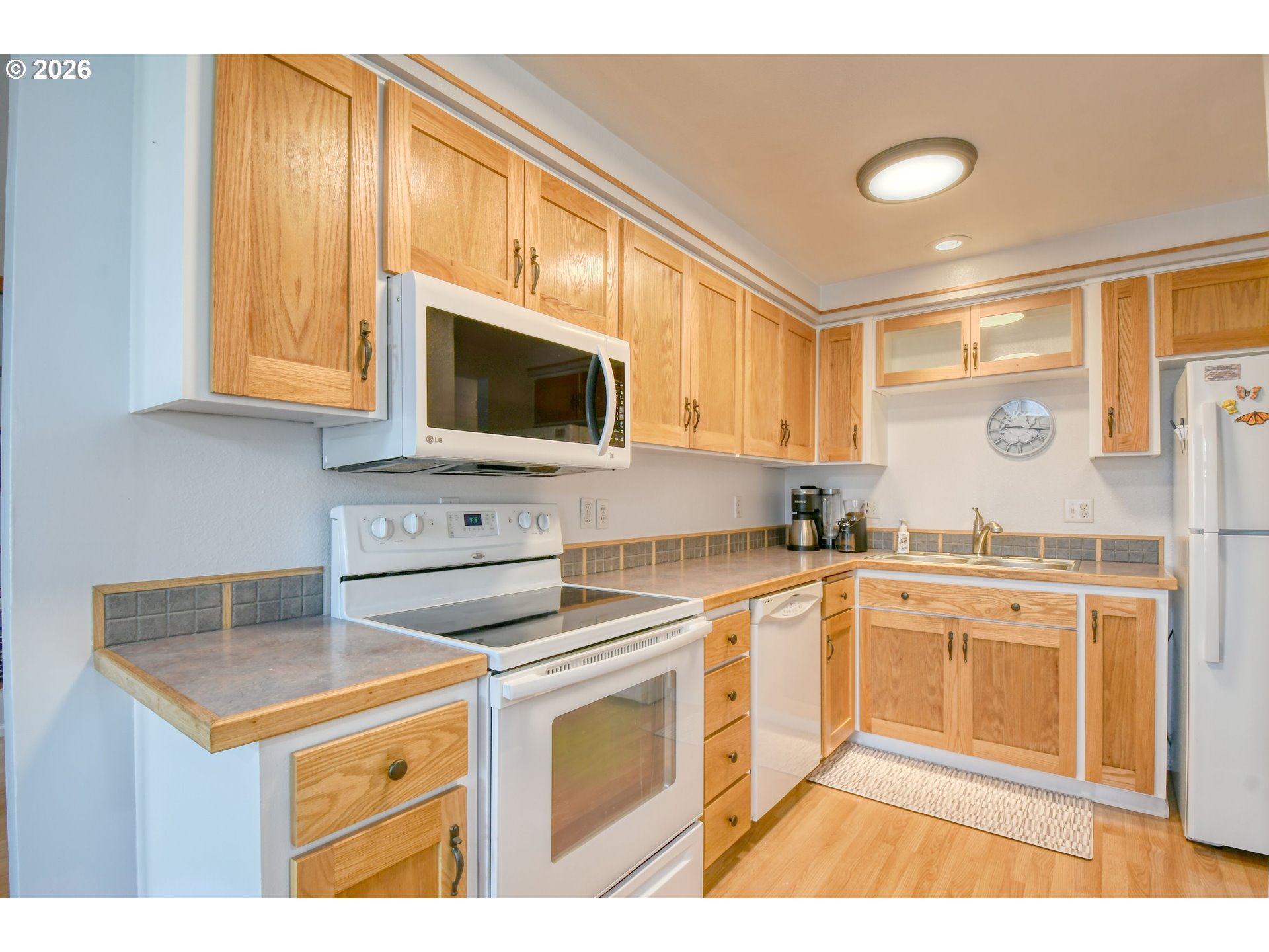 329 West Garfield Street Athena, OR 97813 - Photo 17 of 46 a kitchen with stainless steel appliances granite countertop a stove a sink and a microwave
