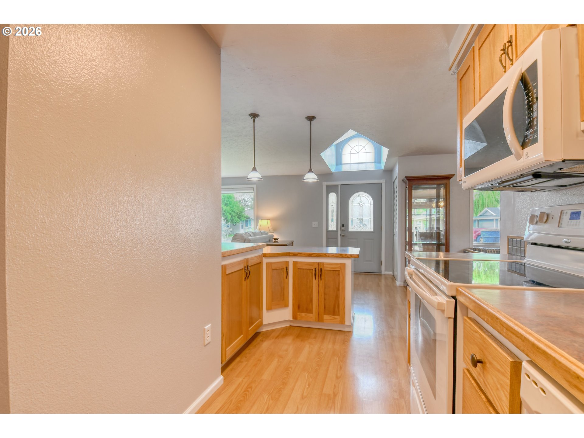329 West Garfield Street Athena, OR 97813 - Photo 18 of 46 a large kitchen with stainless steel appliances a large counter top a stove and a wooden floors