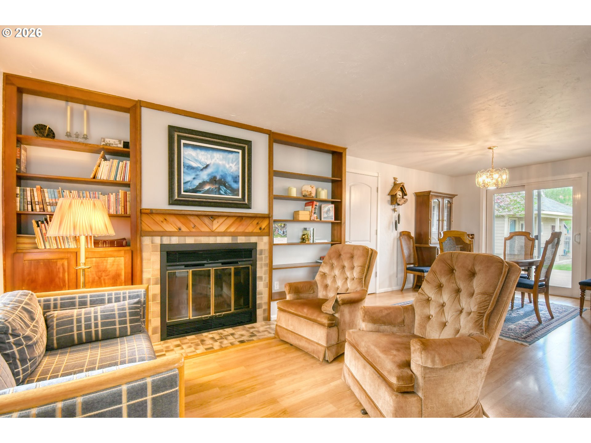329 West Garfield Street Athena, OR 97813 - Photo 21 of 46 a living room with furniture a fireplace and a flat screen tv