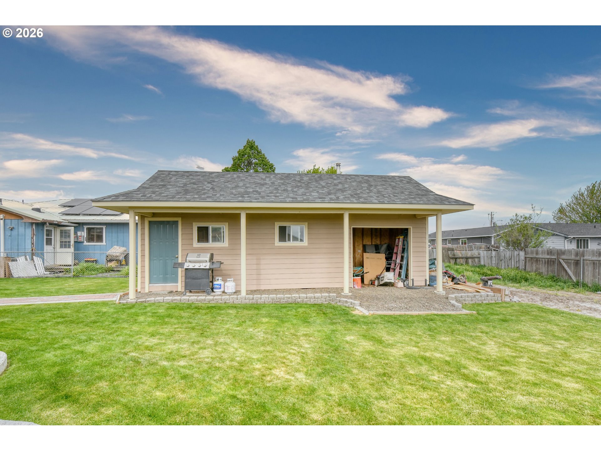 329 West Garfield Street Athena, OR 97813 - Photo 46 of 46 a front view of a house with a garden and outdoor seating
