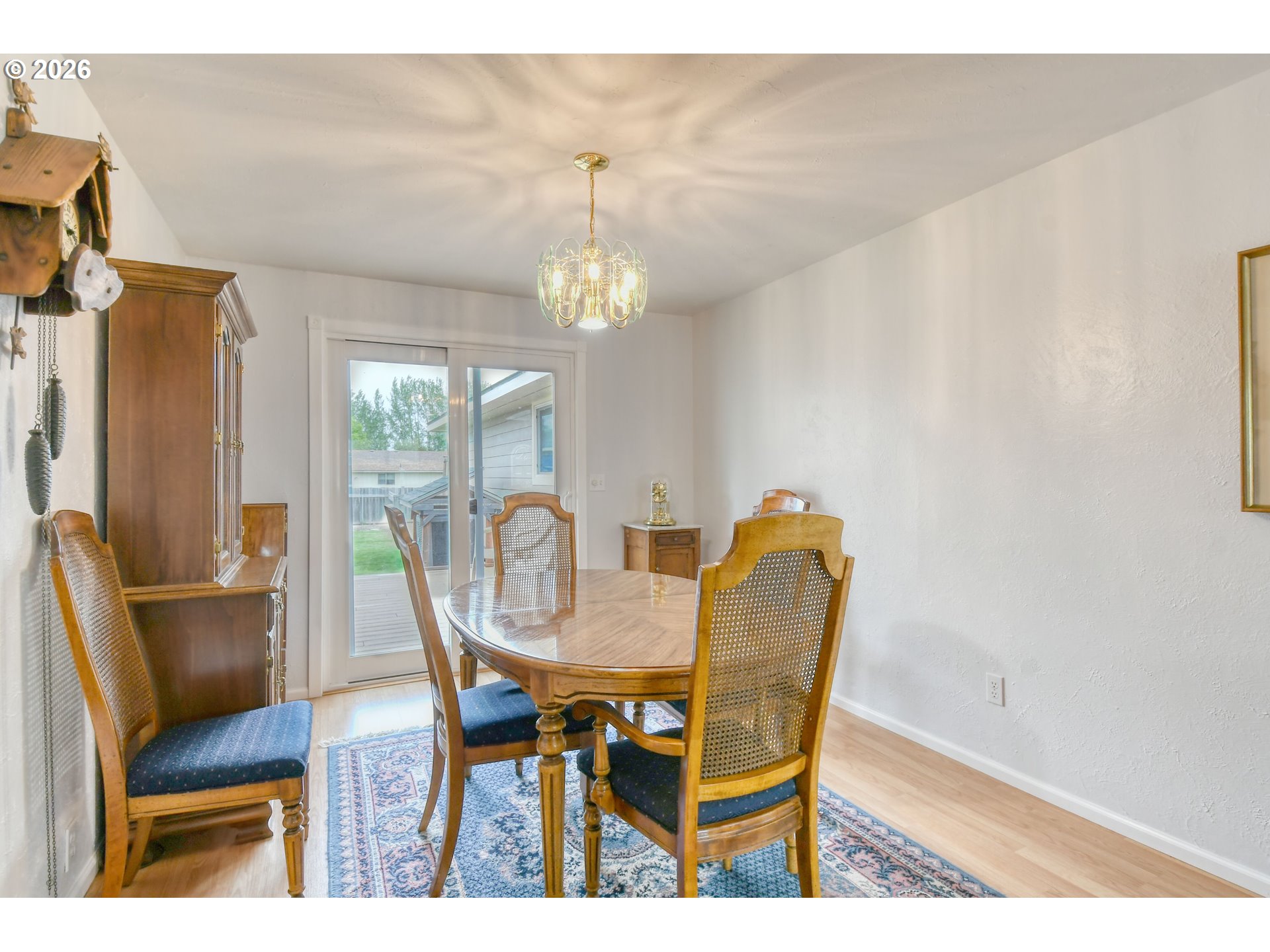 329 West Garfield Street Athena, OR 97813 - Photo 10 of 46 a dining room with furniture a chandelier and wooden floor