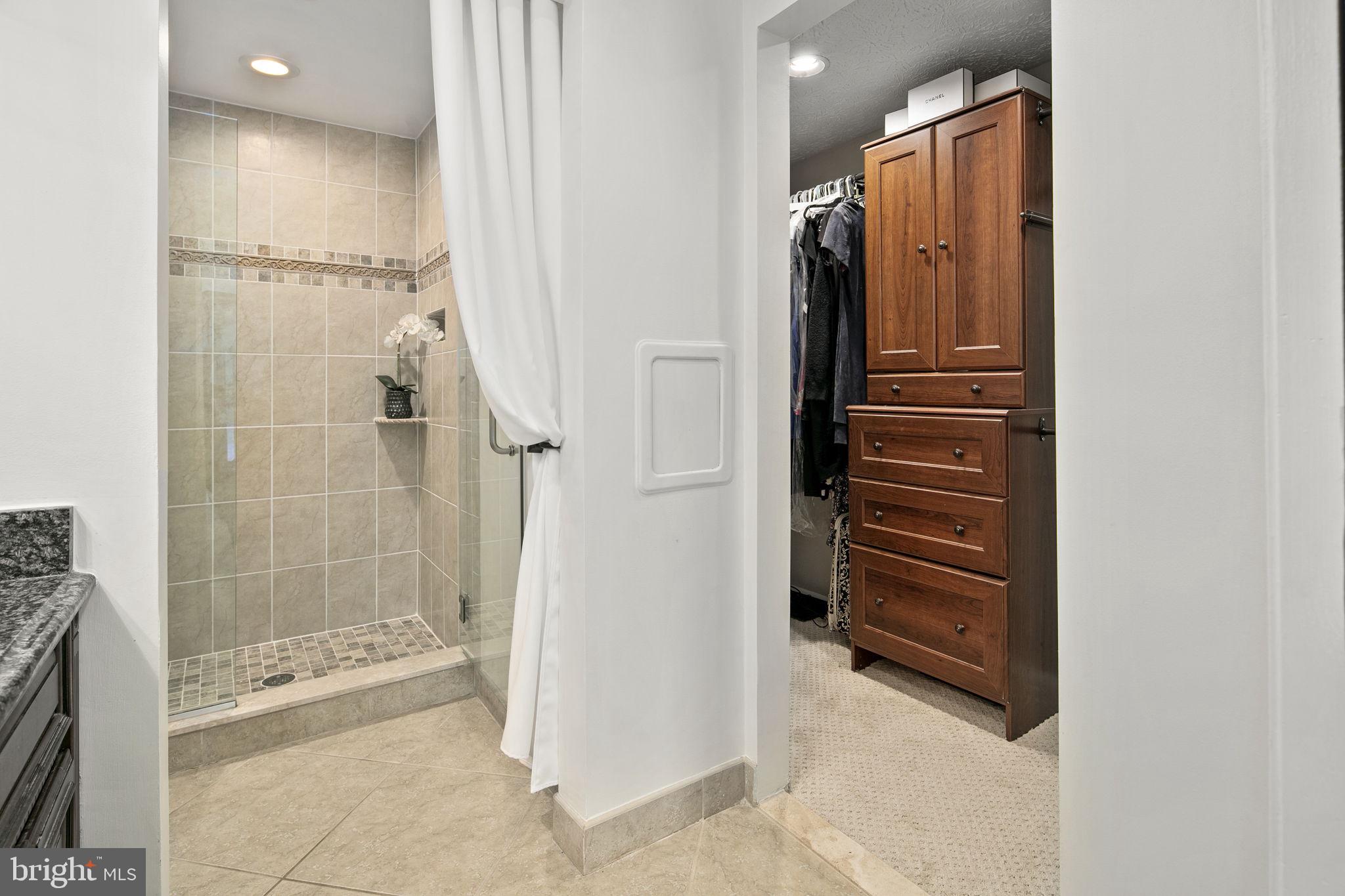 8210 Rushing Creek Drive Springfield, VA 22153 - Photo 38 of 70 primary bath to closet with built-ins