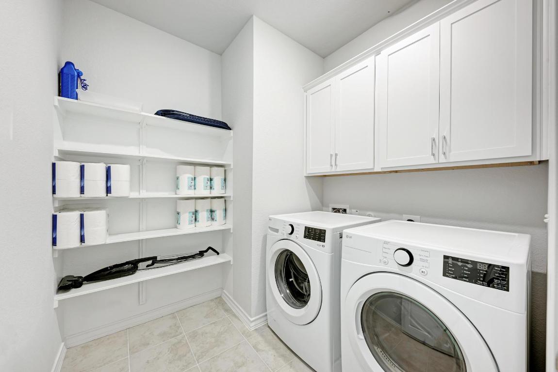 113 Rampart Loop Liberty Hill, TX 78642 - Photo 27 of 40 a utility room with dryer and washer