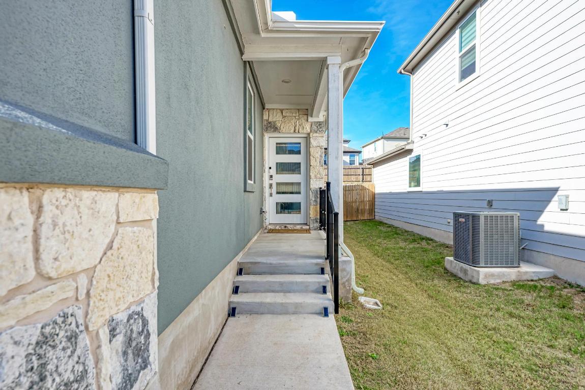 113 Rampart Loop Liberty Hill, TX 78642 - Photo 3 of 40 a view of a pathway of the house