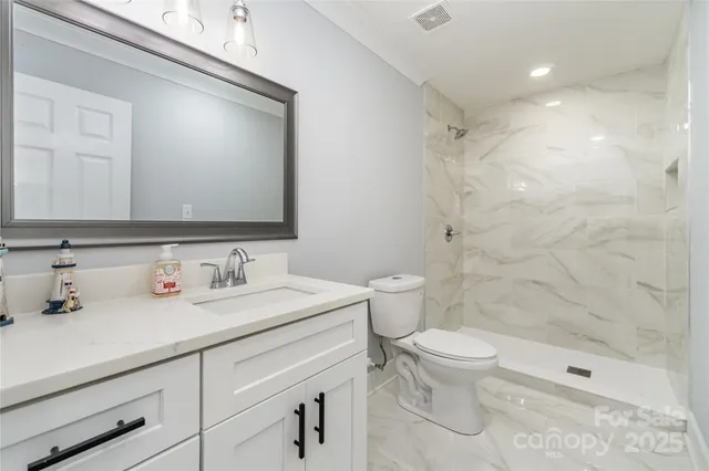 a view of a patio with a table chairs and a backyard