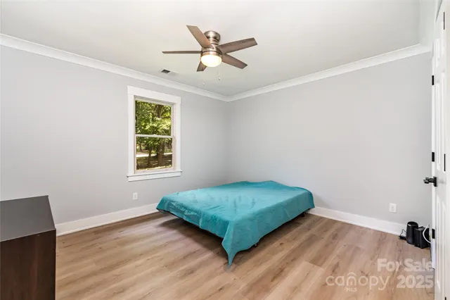 a front view of a house with a yard table and chairs