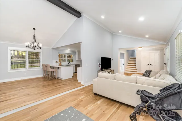 a large kitchen with a table and chairs