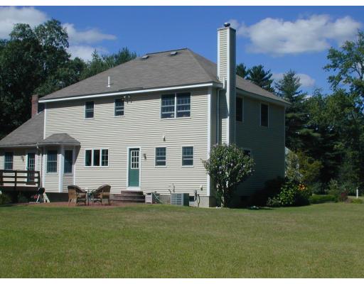 220 Joseph Road Boxborough, MA 01719 - Photo 2 of 9 a front view of a house with a garden