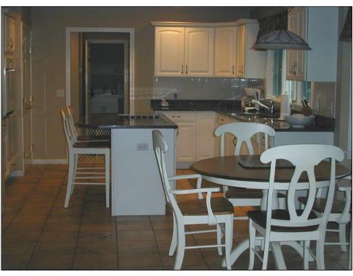 220 Joseph Road Boxborough, MA 01719 - Photo 4 of 9 a kitchen with a sink and cabinets