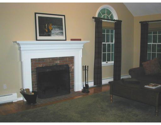 220 Joseph Road Boxborough, MA 01719 - Photo 7 of 9 a living room with a fireplace