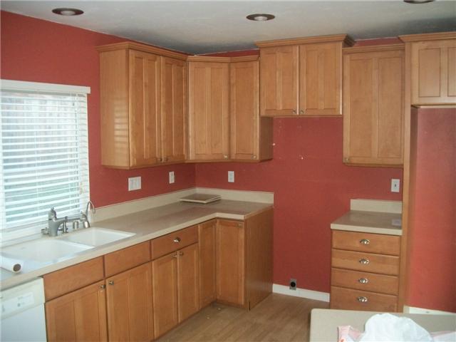 2209 Village Road Escondido, CA 92026 - Photo 5 of 12 Maple Cabinets, Corian Countertops and Hardwood floors in this spacious Kitchen overlooking the park in back.