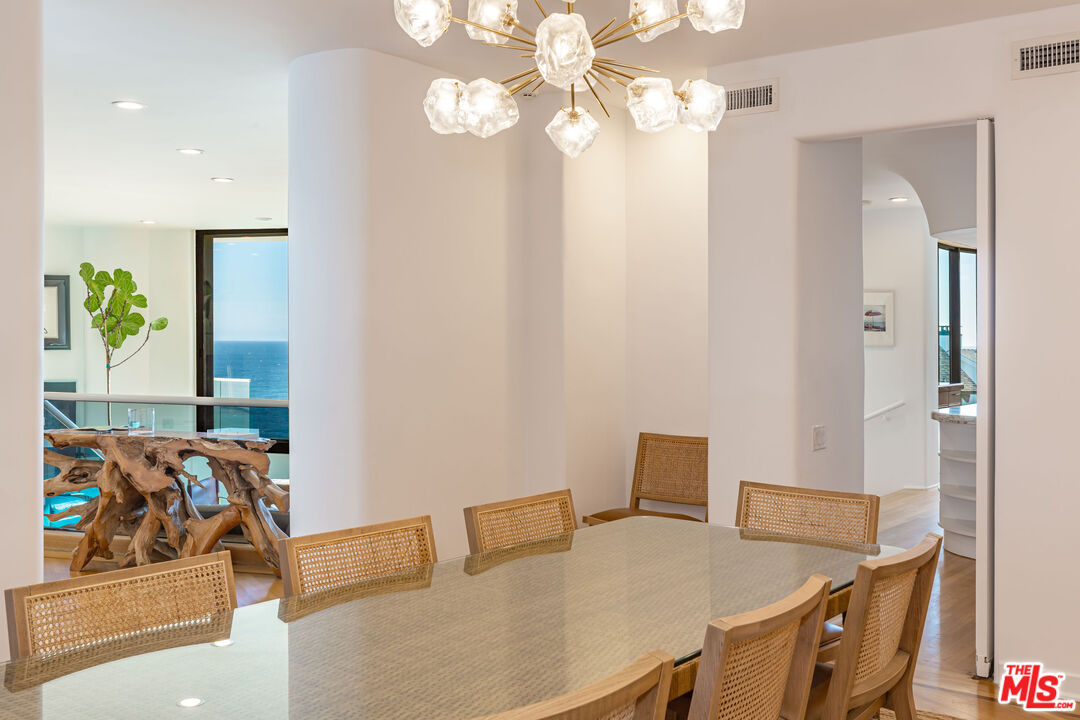 31550 Victoria Point Road Malibu, CA 90265 - Photo 8 of 20 a view of a dining room with furniture