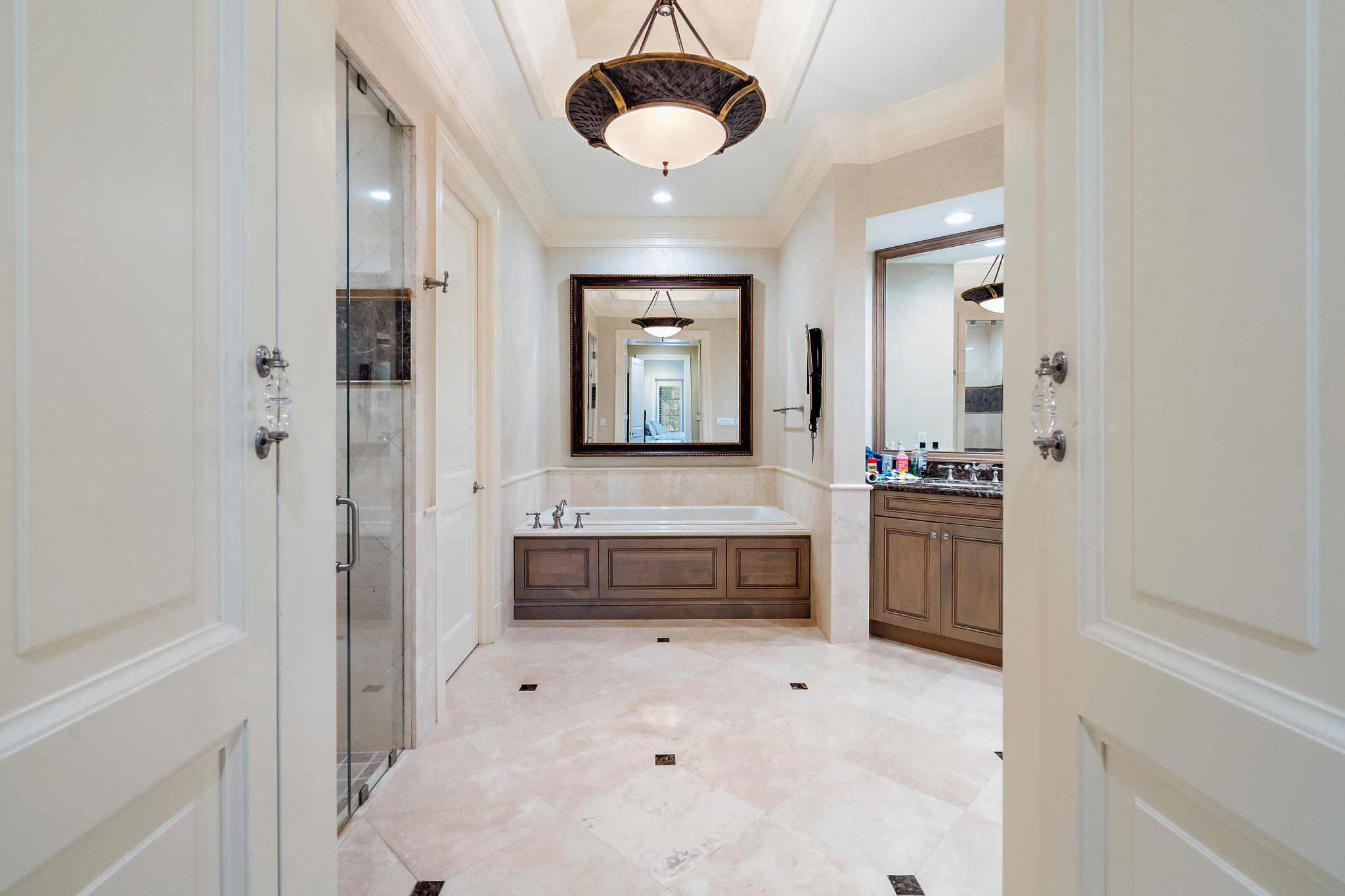426 Red Hawk Drive Jupiter, FL 33477 - Photo 15 of 40 a bathroom with a tub sink and mirror
