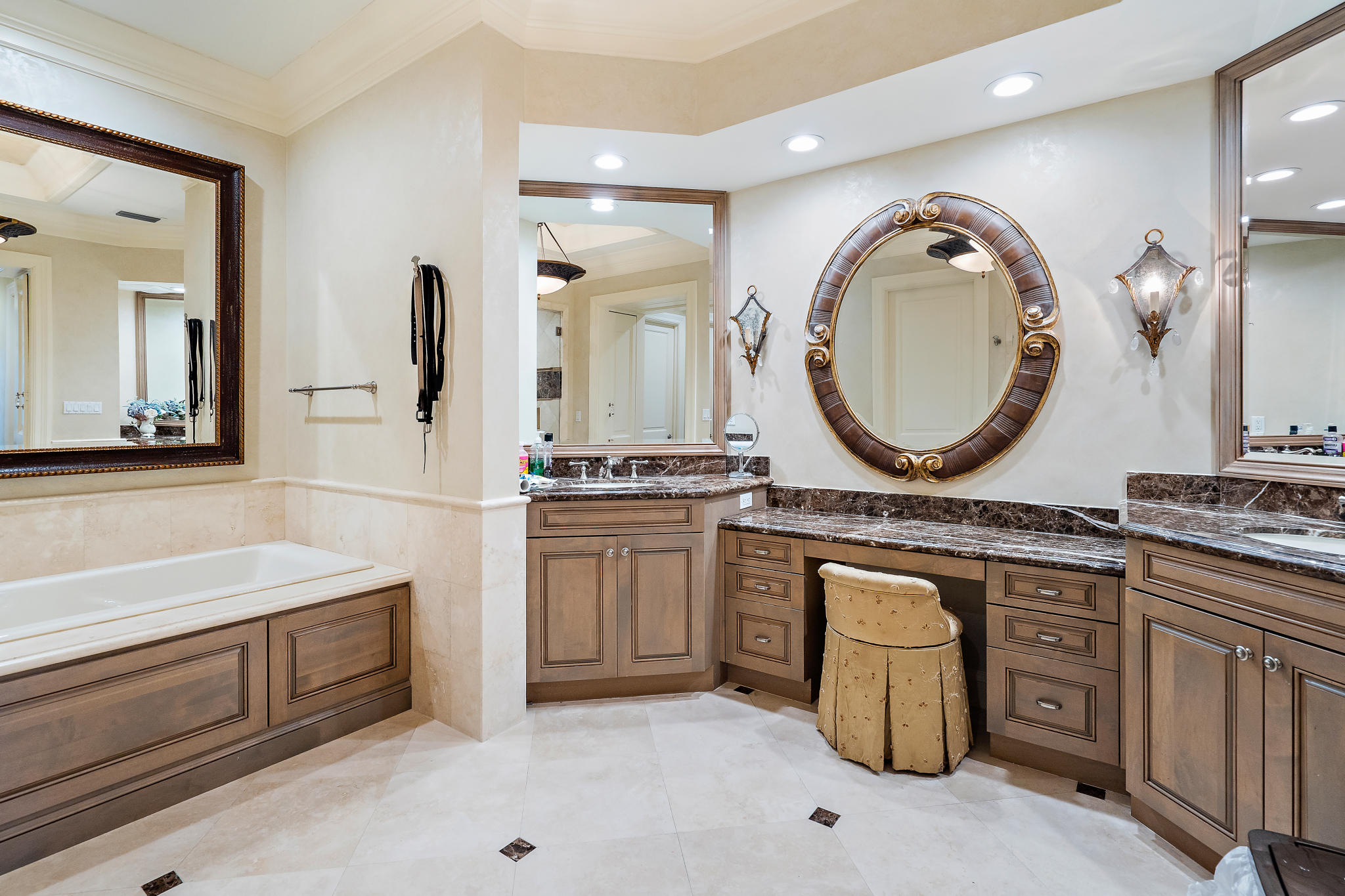 426 Red Hawk Drive Jupiter, FL 33477 - Photo 16 of 40 a bathroom with a double vanity sink and a mirror