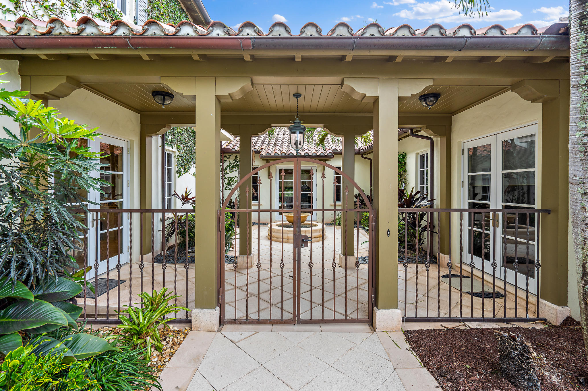 426 Red Hawk Drive Jupiter, FL 33477 - Photo 2 of 40 a front view of a house with a garden
