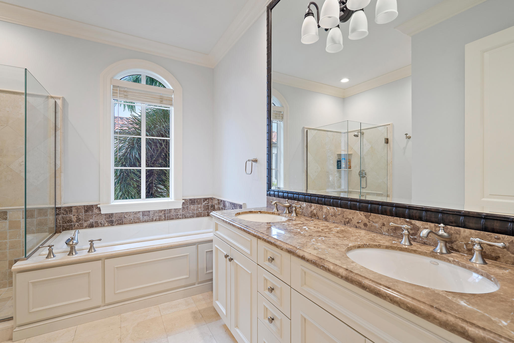 426 Red Hawk Drive Jupiter, FL 33477 - Photo 28 of 40 a bathroom with a granite countertop sink mirror and bathtub