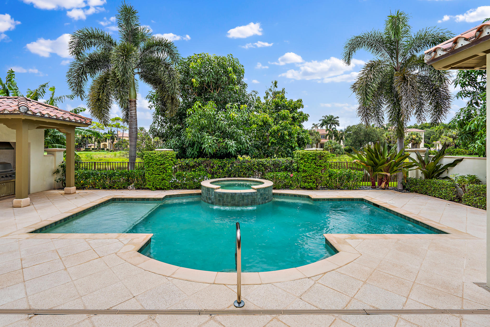 426 Red Hawk Drive Jupiter, FL 33477 - Photo 32 of 40 a view of a swimming pool with a patio