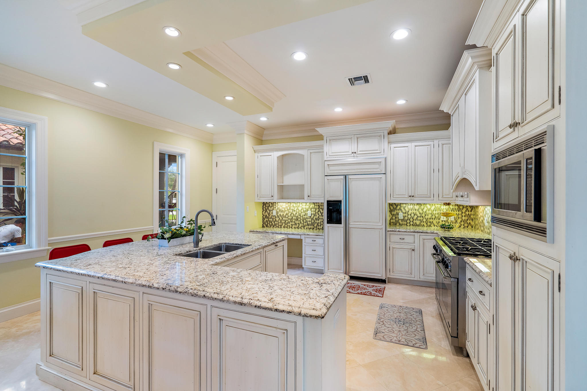 426 Red Hawk Drive Jupiter, FL 33477 - Photo 8 of 40 a kitchen with refrigerator and microwave