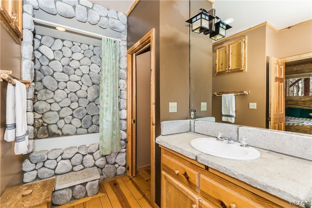 43574 Shasta Road Big Bear Lake, CA 92315 - Photo 11 of 37 a bathroom with a sink and a mirror