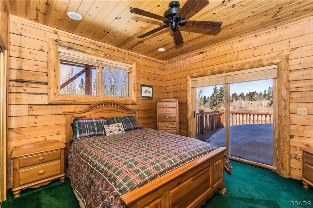 43574 Shasta Road Big Bear Lake, CA 92315 - Photo 12 of 37 a bedroom with a bed next to a window