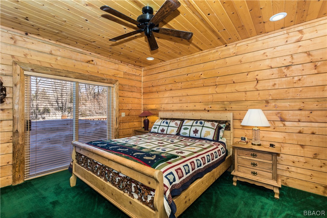 43574 Shasta Road Big Bear Lake, CA 92315 - Photo 15 of 37 a bed room with a bed and a dresser