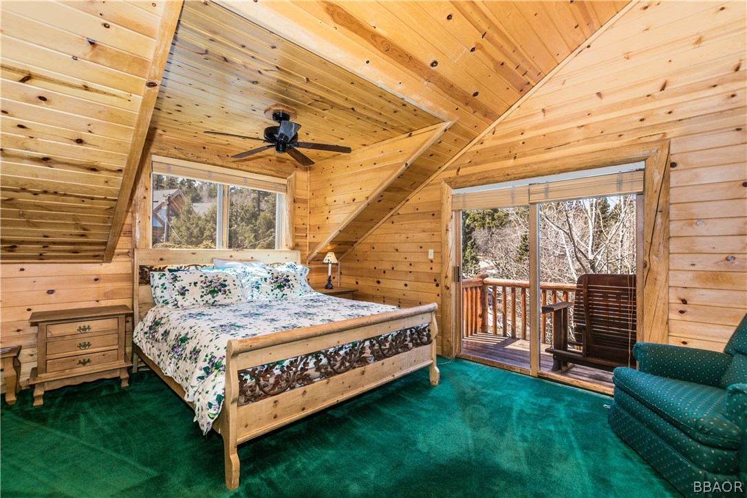 43574 Shasta Road Big Bear Lake, CA 92315 - Photo 19 of 37 a bedroom with a bed and a view of the balcony