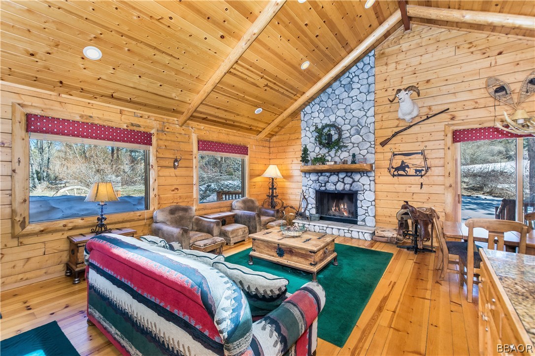 43574 Shasta Road Big Bear Lake, CA 92315 - Photo 2 of 37 a living room with fireplace furniture and a fireplace