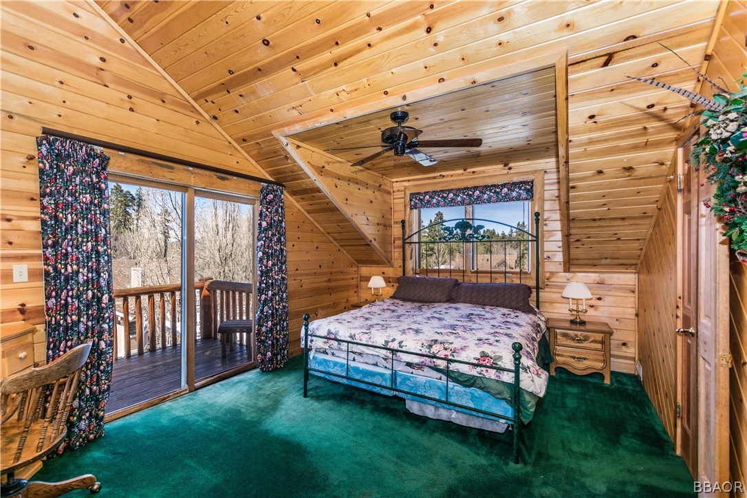 43574 Shasta Road Big Bear Lake, CA 92315 - Photo 23 of 37 a bedroom with a bed and a table