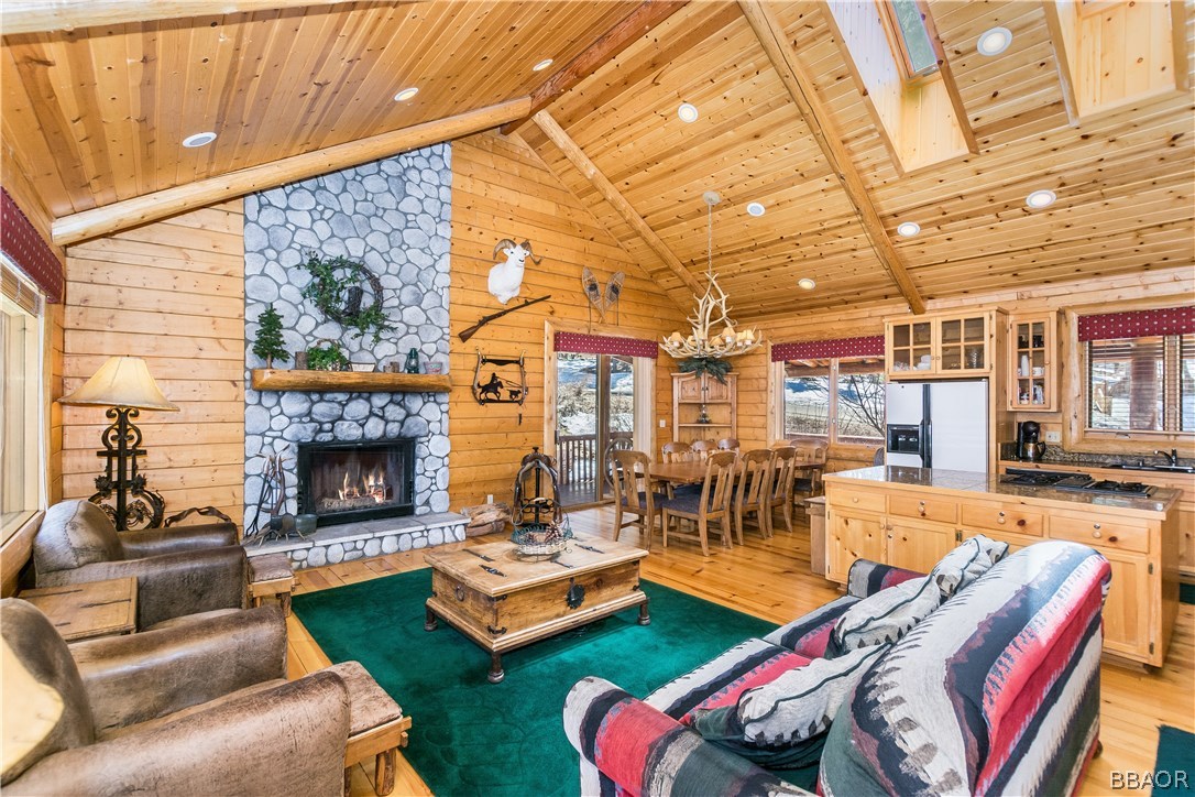 43574 Shasta Road Big Bear Lake, CA 92315 - Photo 3 of 37 a living room with furniture and a fireplace