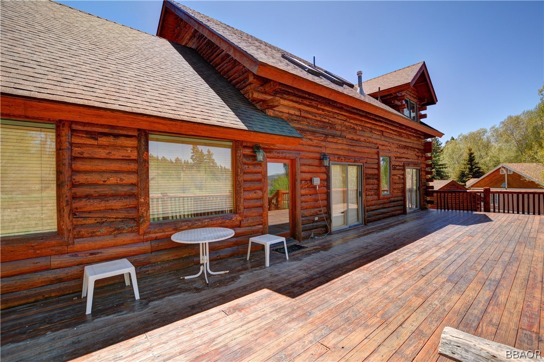 43574 Shasta Road Big Bear Lake, CA 92315 - Photo 33 of 37 a balcony with furniture and wooden floor