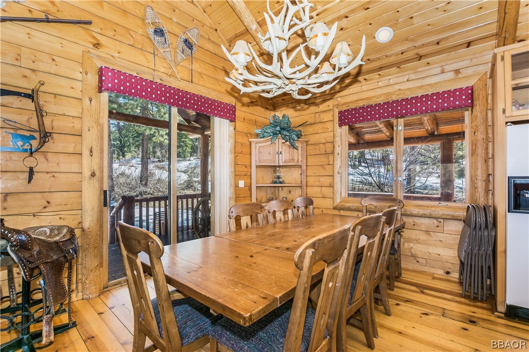 43574 Shasta Road Big Bear Lake, CA 92315 - Photo 5 of 37 a dining room with furniture a chandelier and a rug