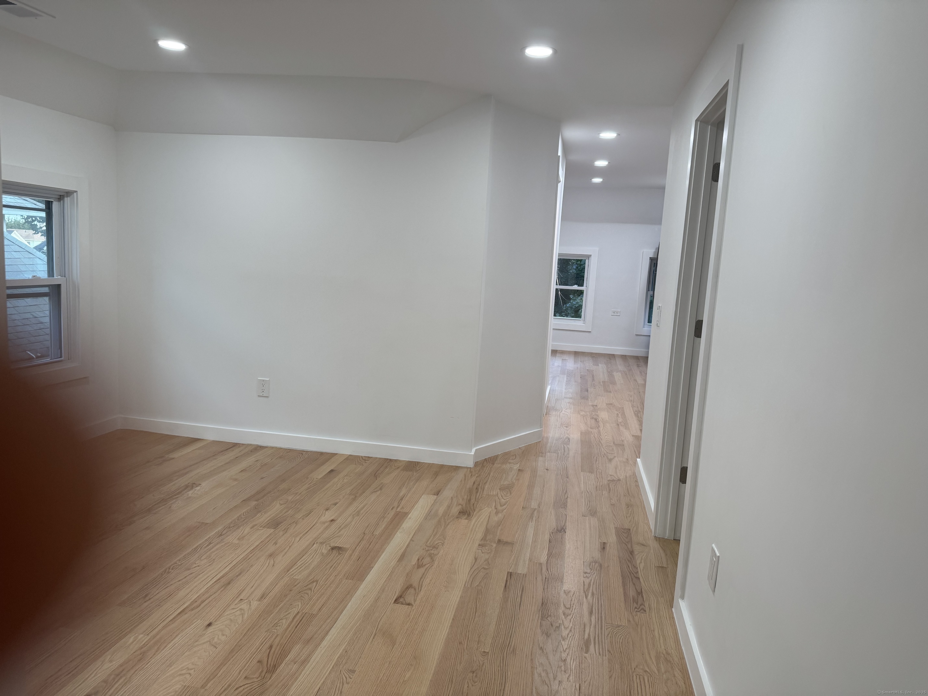 263 Hawley Avenue Bridgeport, CT 06606 - Photo 12 of 19 a view of hallway with wooden floor
