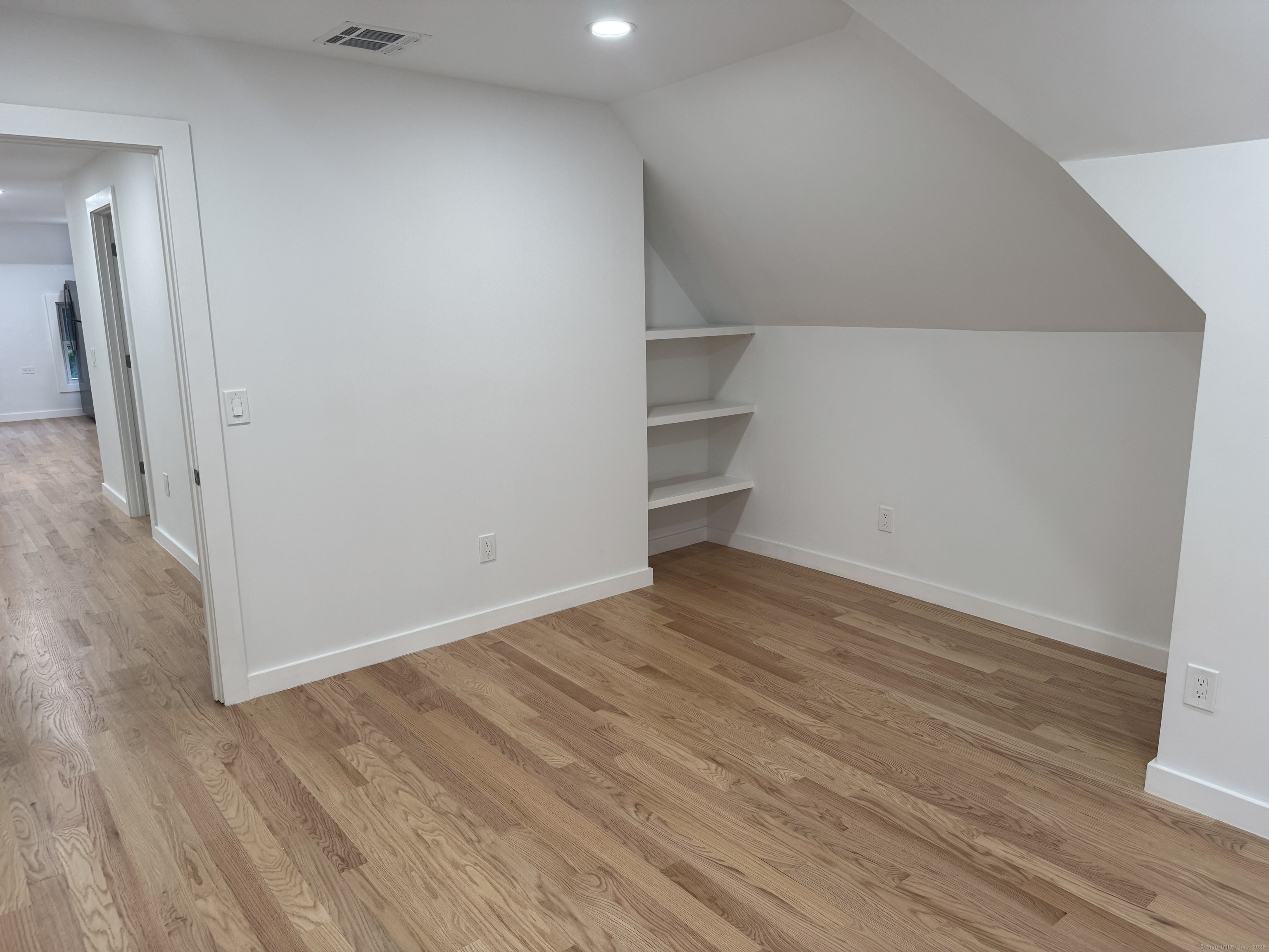 263 Hawley Avenue Bridgeport, CT 06606 - Photo 7 of 19 a view of empty room with wooden floor