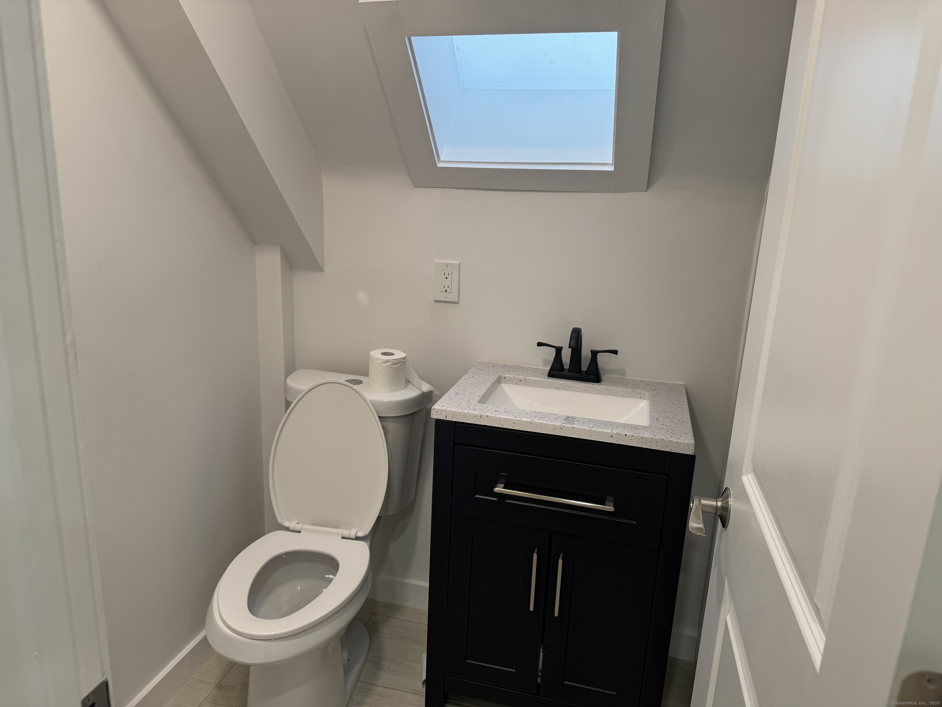 263 Hawley Avenue Bridgeport, CT 06606 - Photo 8 of 19 a bathroom with a sink and a toilet