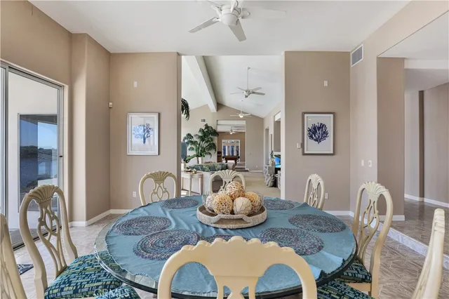 a living room with furniture potted plant and a window