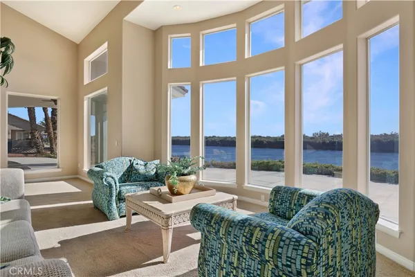 a room with pool table and windows