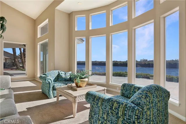 a room with pool table and windows
