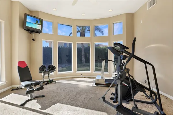 a swimming pool with outdoor seating and deck