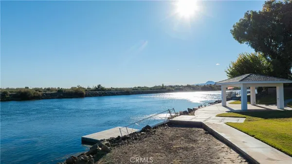 a view of a house with backyard porch and sitting area