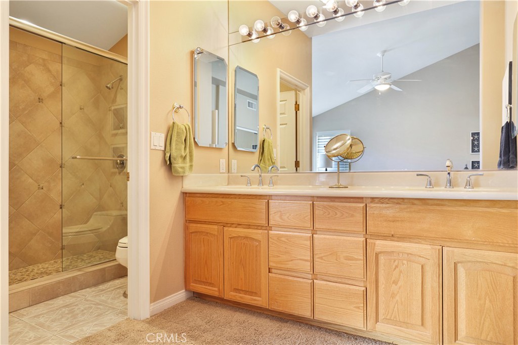 7645 Rio Vista Drive Big River, CA 92242 - Photo 38 of 56 a bathroom with a double vanity sink mirror and shower