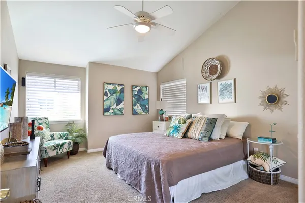 a bedroom with a bed and a couch