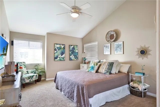 a bedroom with a bed and a couch