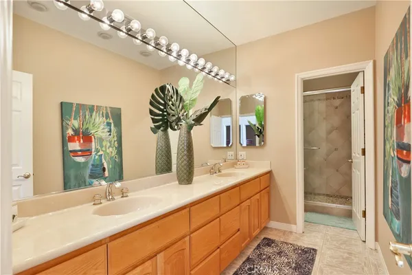 a bedroom with a bed and a potted plant