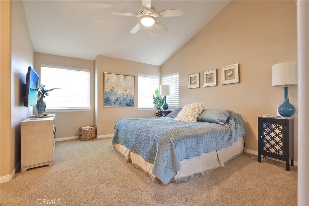 7645 Rio Vista Drive Big River, CA 92242 - Photo 48 of 56 a spacious bedroom with a large bed and a chandelier