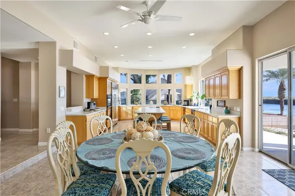 a view of a dining room with furniture and chandelier